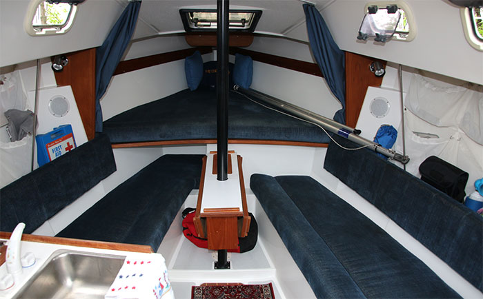 Dinette with drop leaf table. Bow V-berth.